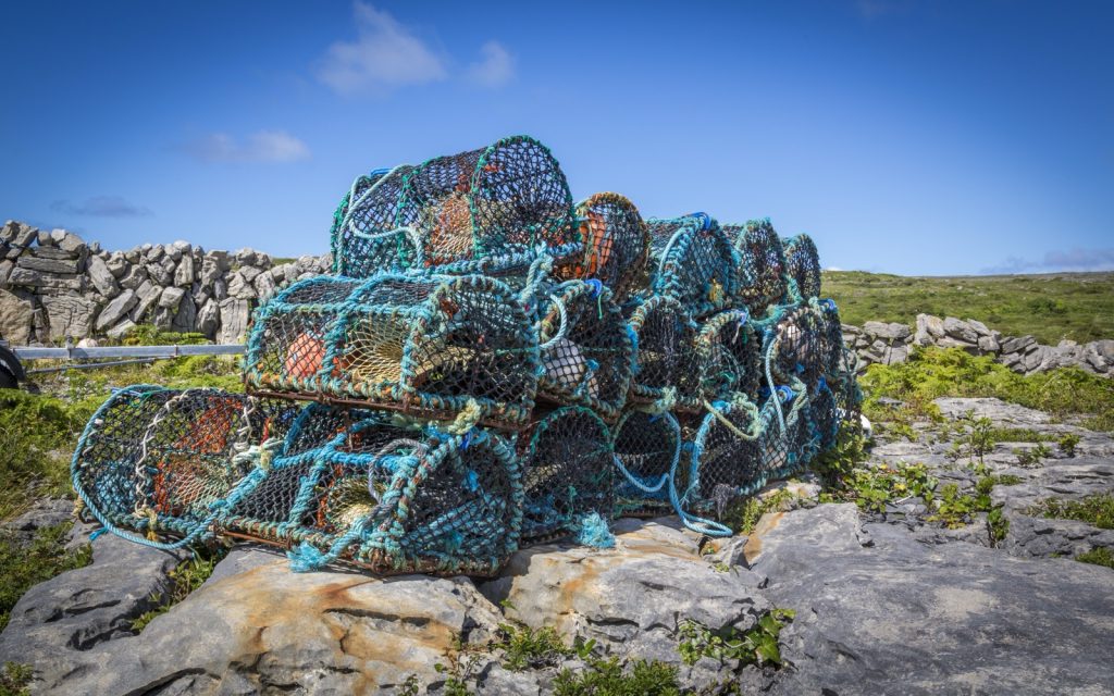Lobster pots stacked on the rocks in West Cork